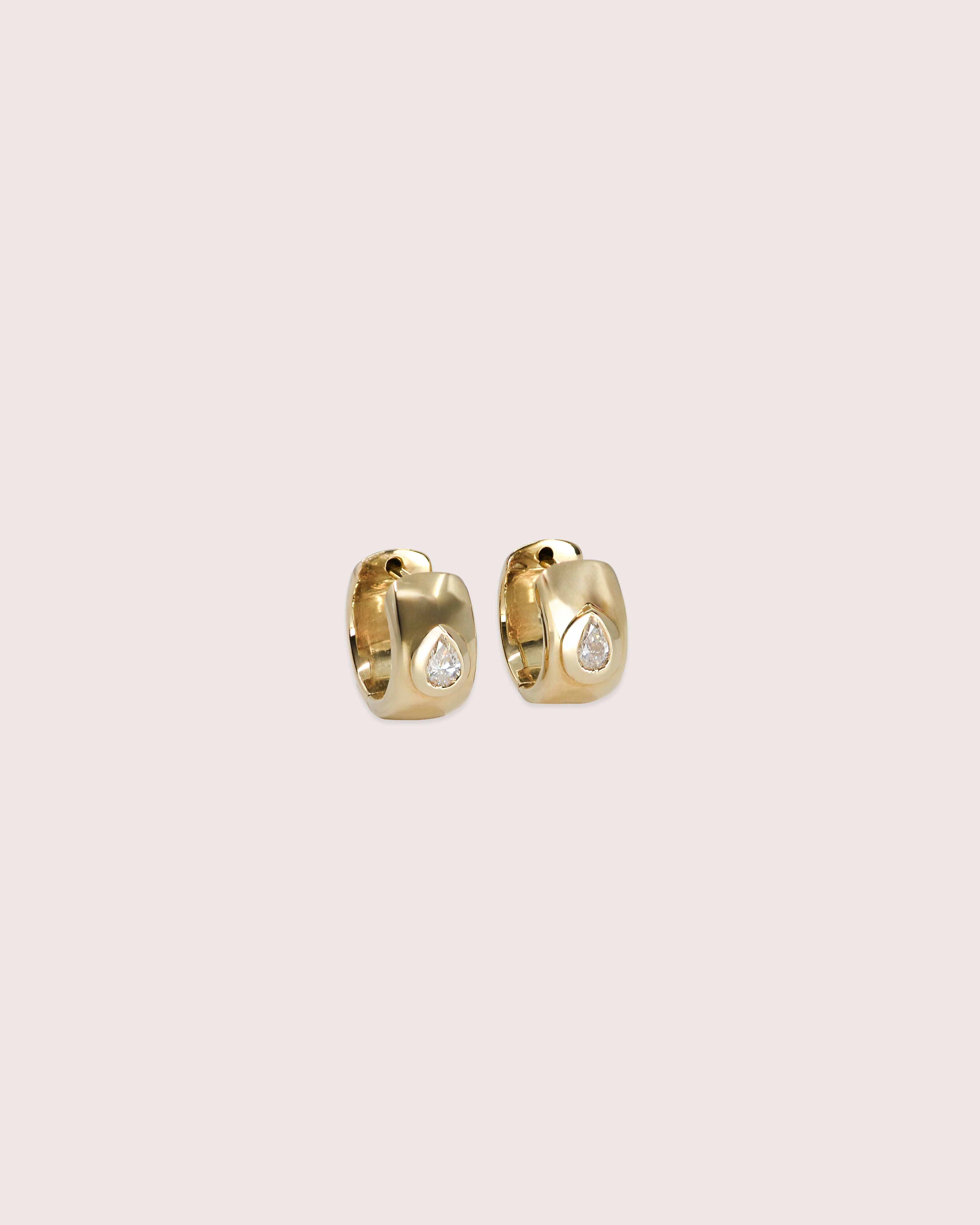 Bold Pear Diamond Huggie Earrings