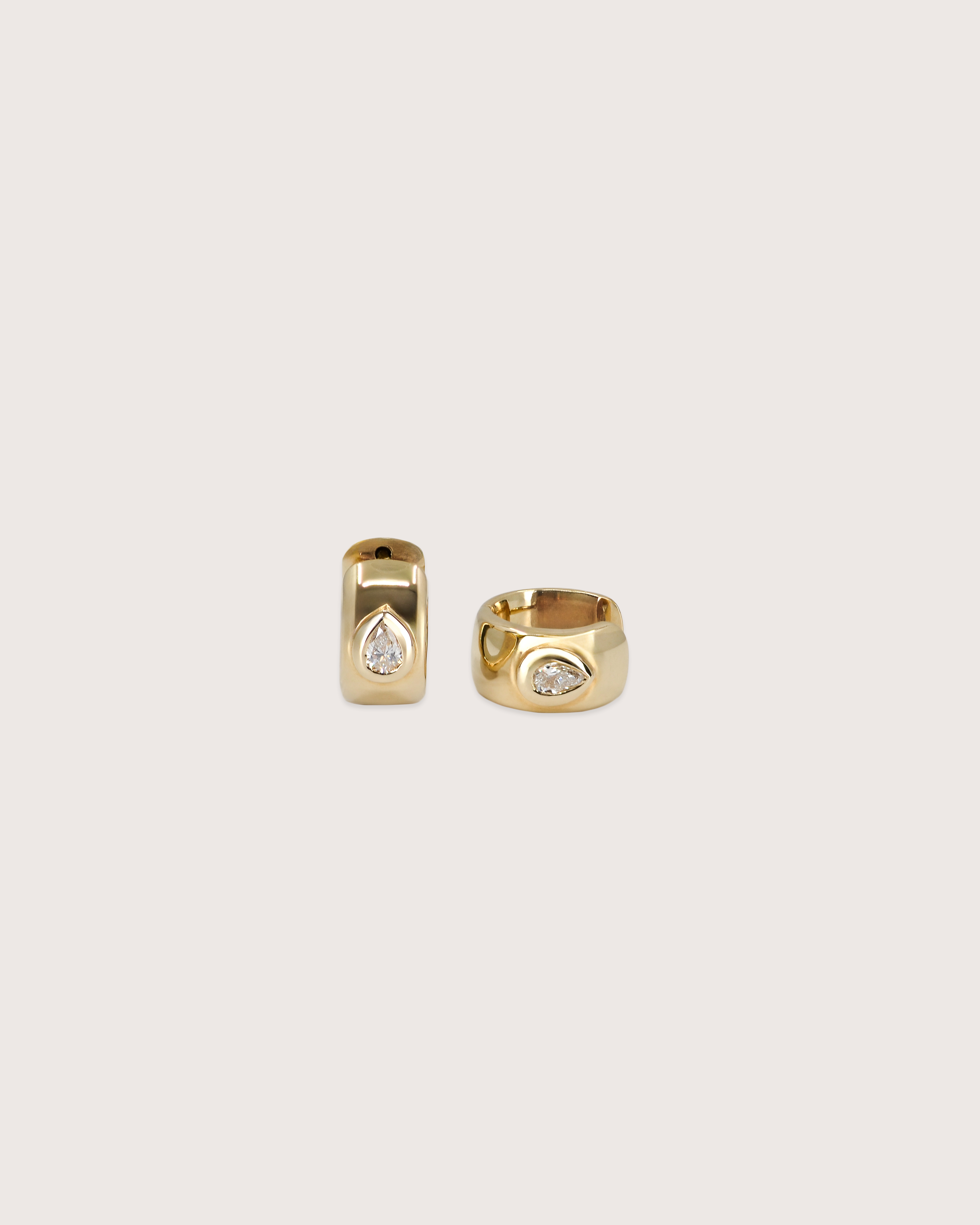 Bold Pear Diamond Huggie Earrings