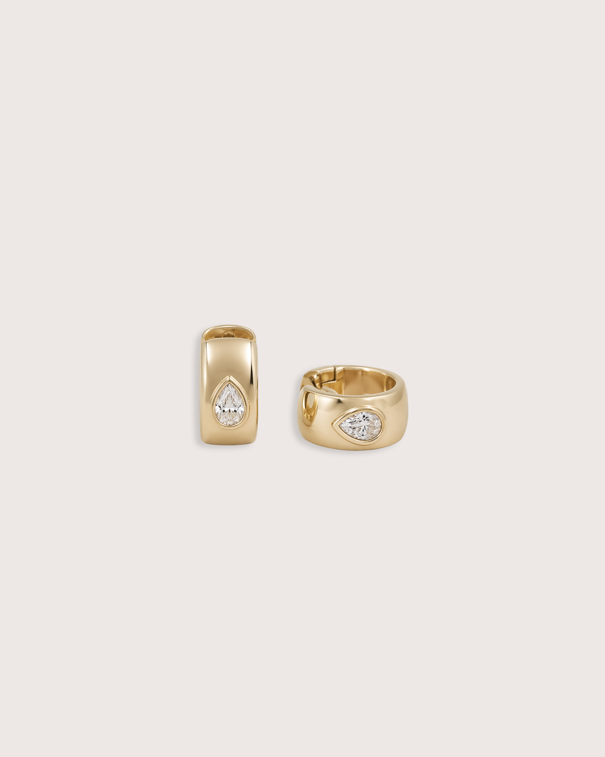 Bold Pear Diamond Huggie Earrings